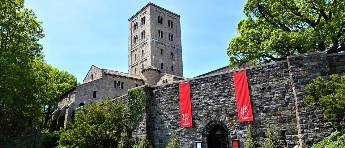 Stone entrance and towers of The Met Cloisters in Fort Tryon Park