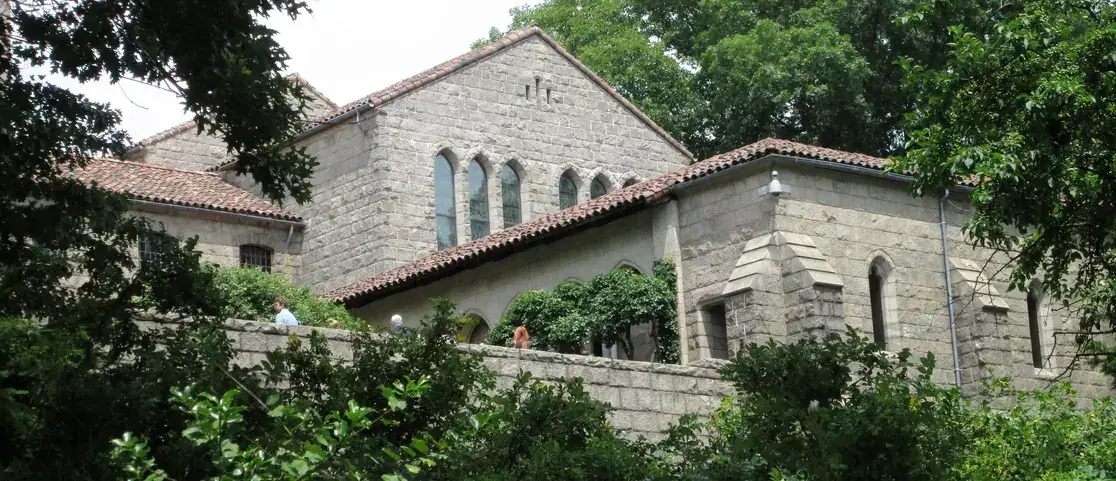 The Cloisters’ Bonnefont and Trie garden roofs and stone towers seen from Fort Tryon Park