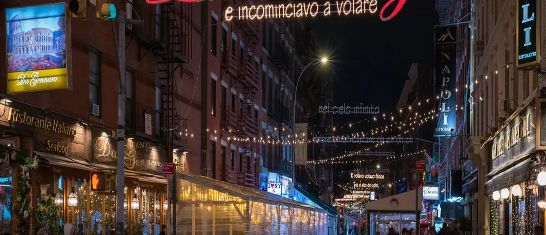Elegant street-level entrance of a boutique hotel in Flatiron NoMad Manhattan with green ivy facades