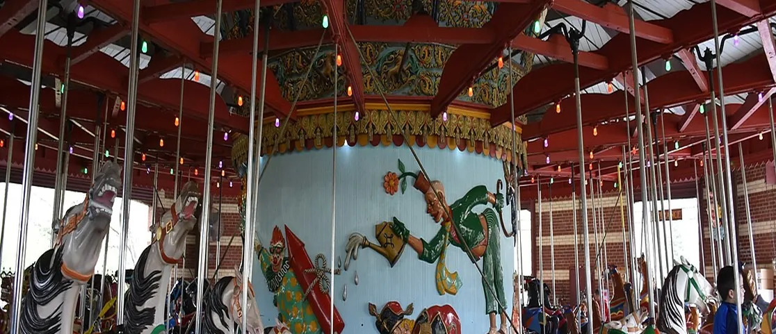 Historic Central Park Carousel with hand-carved wooden horses and colorful canopy