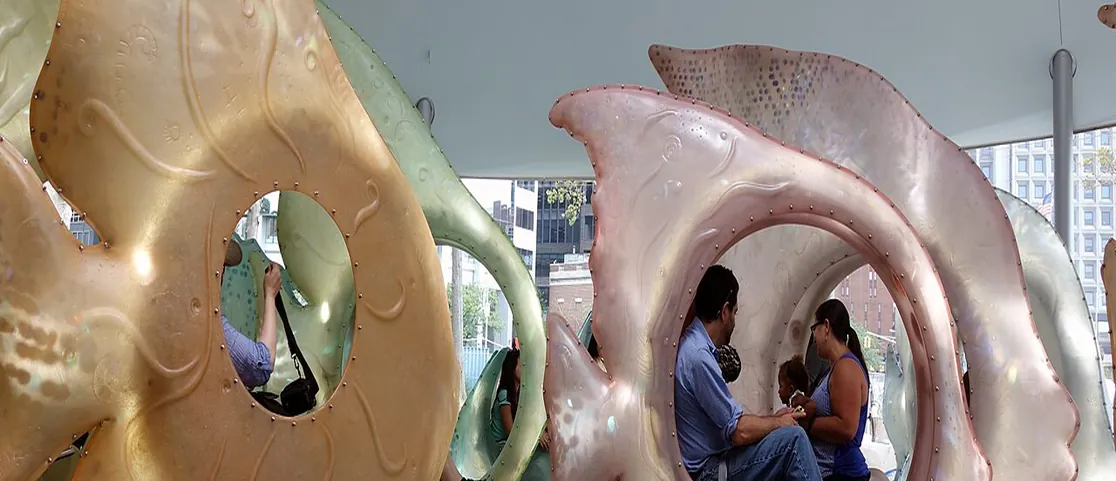 Whimsical glowing fish structures at the SeaGlass Carousel in The Battery