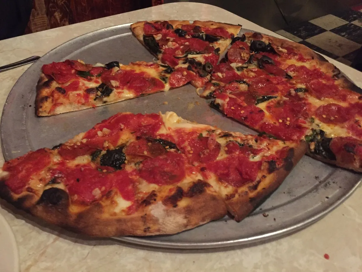 Whole coal-fired brick oven pepperoni pie served at John’s of Bleecker Street