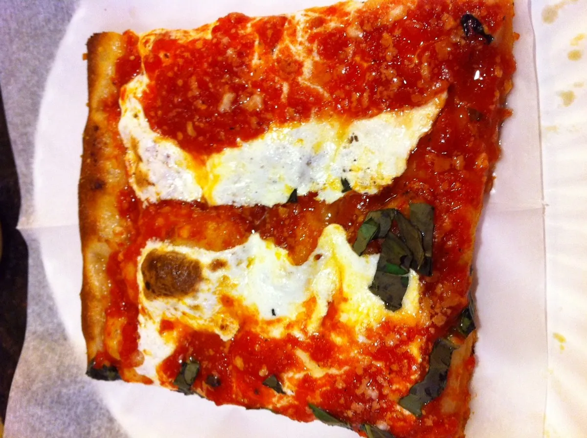 Famous pepperoni square Sicilian slice with crispy cupped pepperoni at Prince Street Pizza