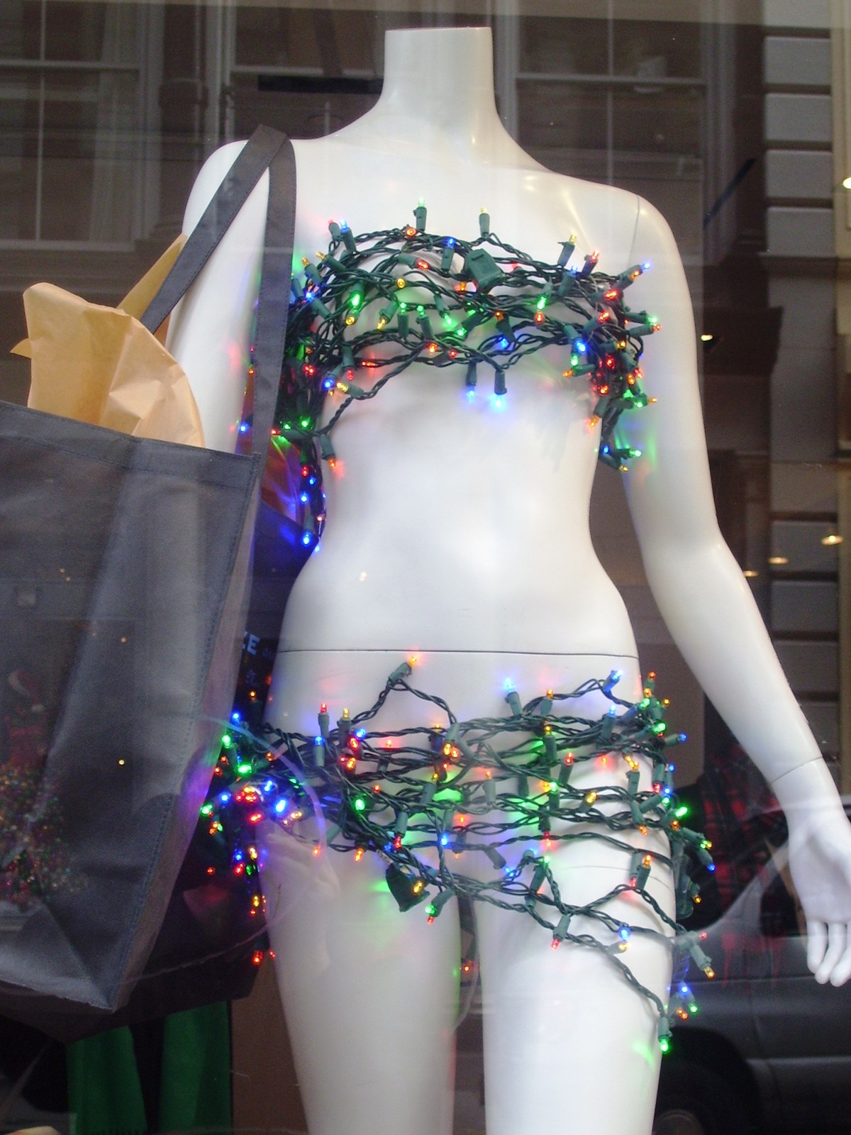 Boutique storefront along Greene Street cobblestone sidewalk in SoHo