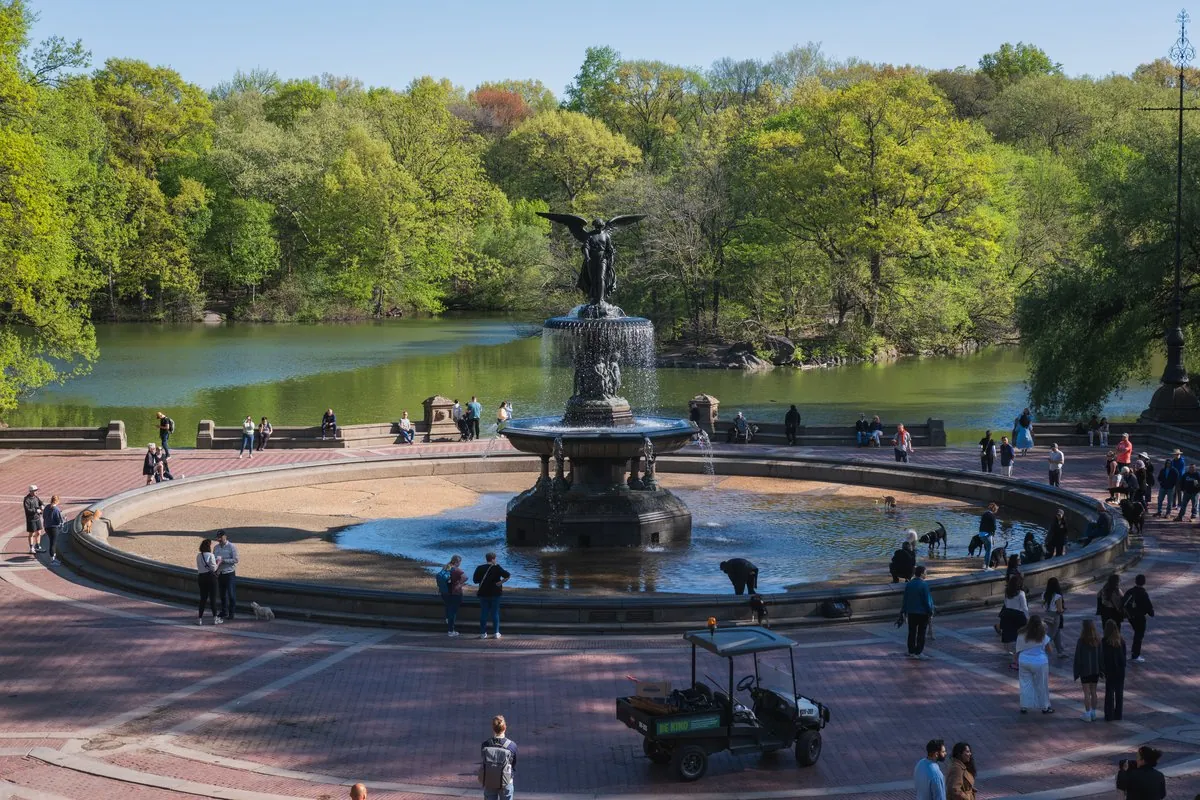 Bethesda Fountain and Bethesda Terrace reflecting on the Central Park lake