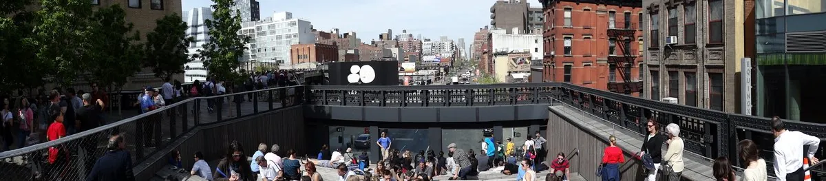 Panoramic elevated view of Manhattan buildings from The High Line pedestrian walkway.