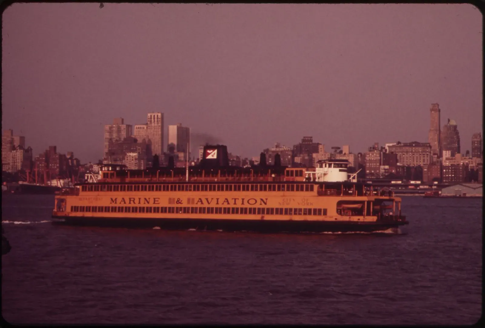 Staten Island Ferry passing New York Harbor with Lower Manhattan skyline