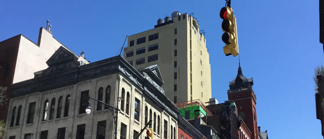 Historic 18th-century Federal-style rowhouses along Harrison Street in Tribeca Manhattan