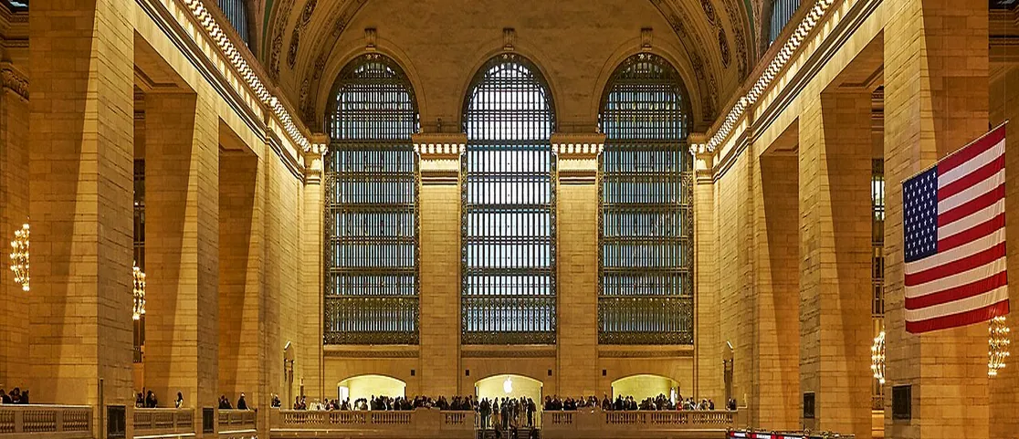 Grand Central Terminal Main Concourse with warm glowing chandeliers and celestial ceiling in winter